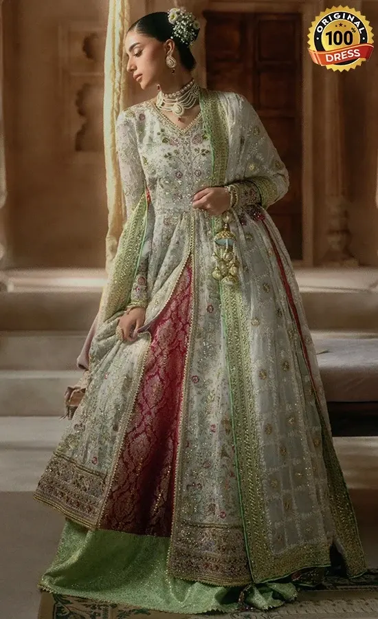 Pakistani mint green salwar kameez for wedding guests with intricate embroidery and graceful formal styling
