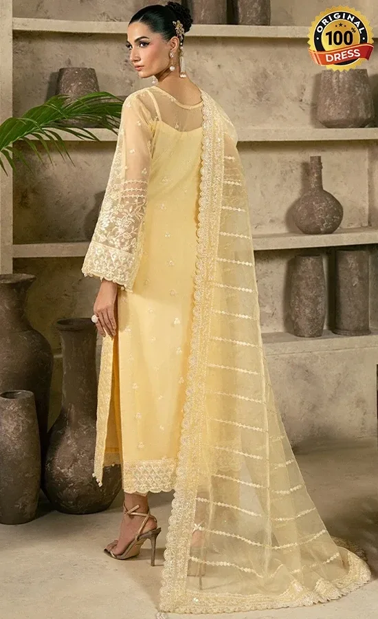 Pakistani pastel yellow salwar kameez for wedding guests with embroidered organza and graceful formal styling
