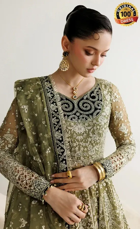 Embroidered green lehenga choli for wedding guests with tassels, kiran lace and patchwork detailing