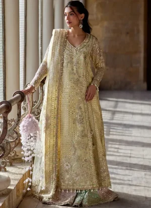 Yellow shalwar kameez with embroidered front panels and patchwork detailing