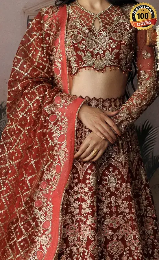 Pakistani orange lehenga choli for wedding guests with elegant embroidery and festive formal styling