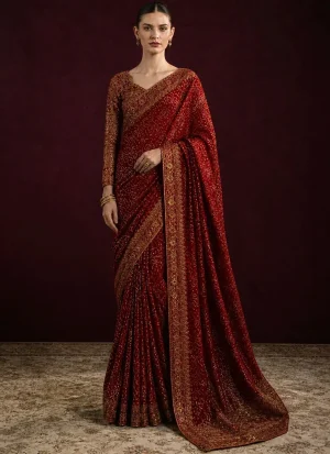 Maroon colour saree with matching embroidered silk blouse for wedding guests, featuring traditional embroidery and tassel detailing