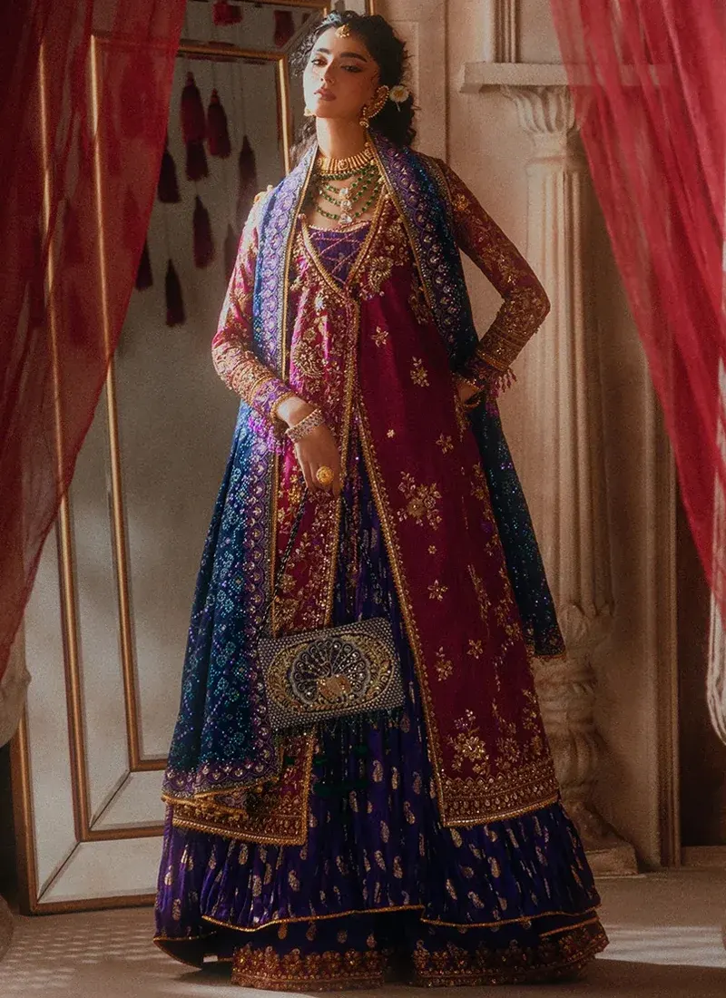 Royal blue wedding guest suit with embroidered borders, tassels and detailed finishing