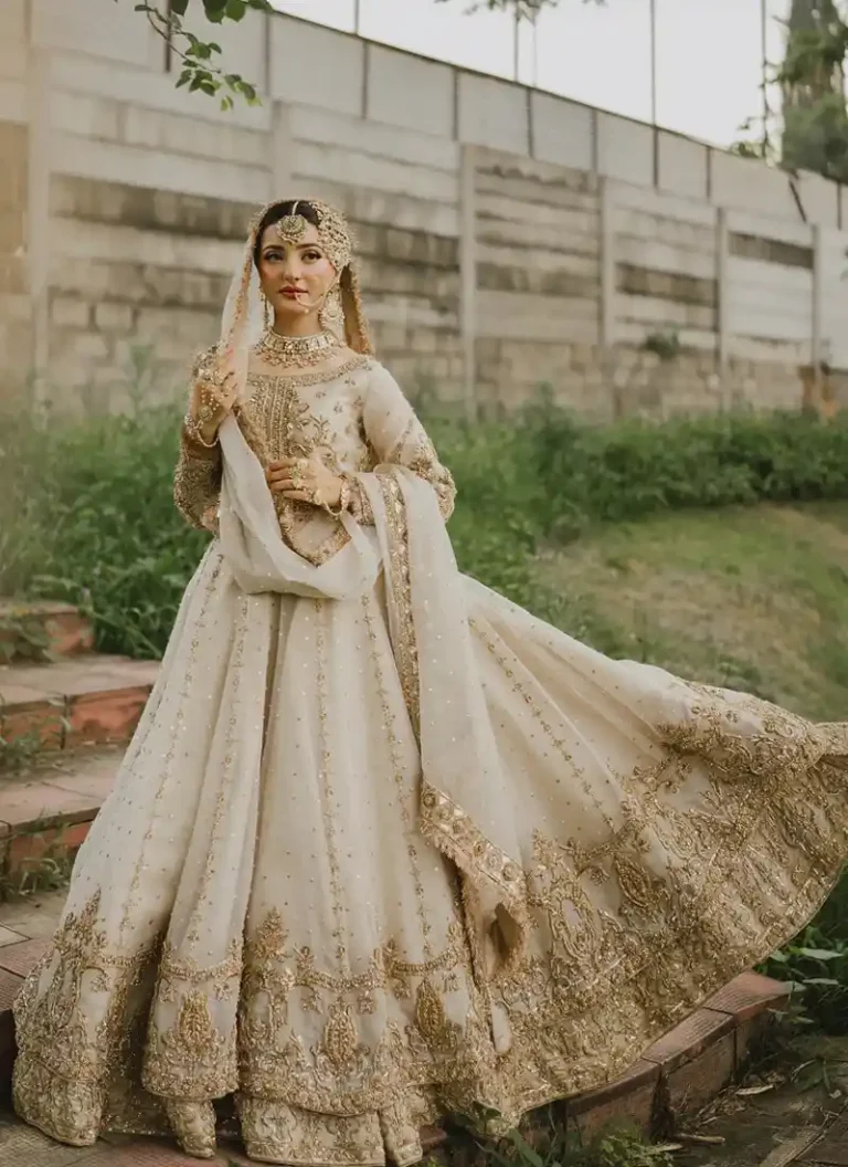 Embroidered ivory gold bridal gown with traditional zardozi and handcrafted detailing