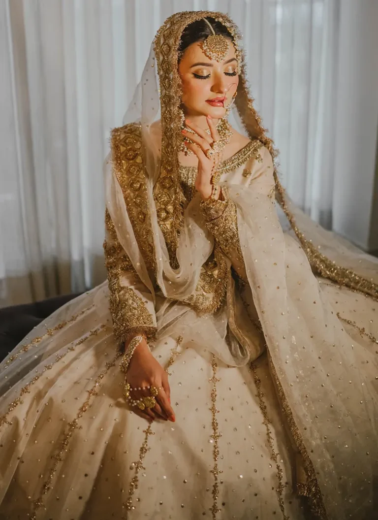 Ivory gold bridal gown with intricate hand embroidery and elegant Nikkah styling