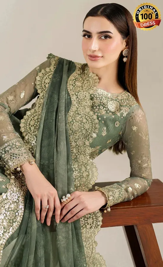 Pakistani green maxi dress for wedding guests with embroidered chiffon and formal styling