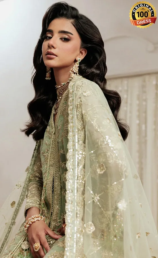 Pakistani sage green salwar kameez for wedding guests with embroidered organza and detailed finishing