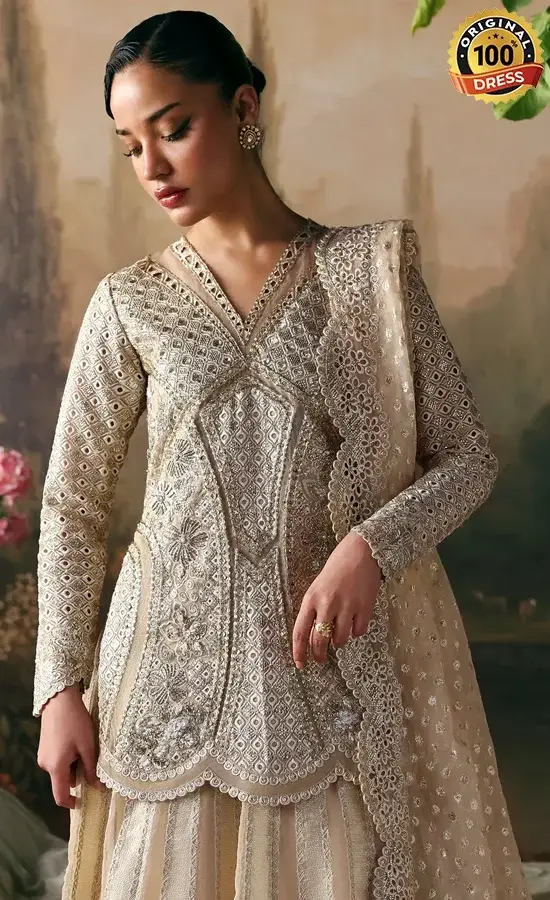 Beige organza lehenga dress with hand embroidery, flared styling and traditional finishing