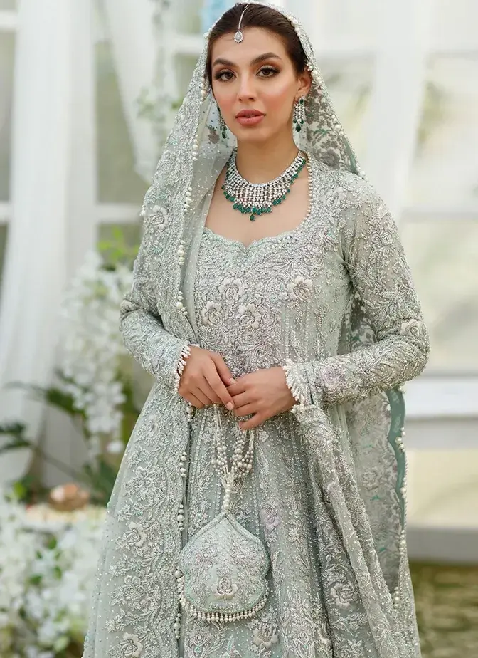 Three-piece aqua wedding dress with long frock, lehenga and 3.5-yard organza dupatta.