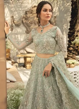 Mint green Walima lehenga in organza with silver embroidery and full-sleeve boat-neck blouse