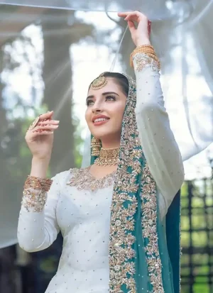 White Nikkah lehenga with organza kurti, blue-accent dupatta and mixed-metal embroidery