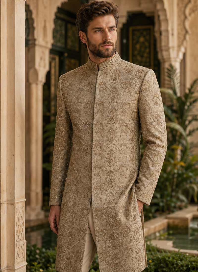 Beige embroidered sherwani for groom in a full-length traditional wedding look