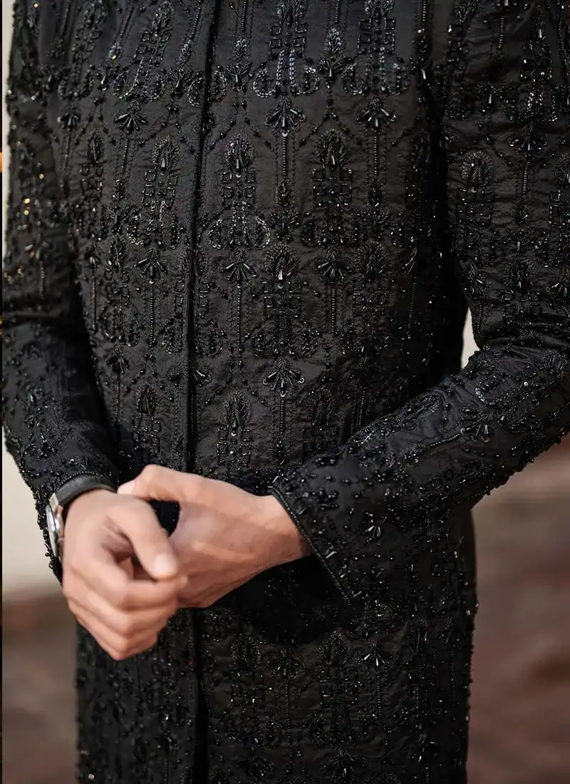 Close-up of black-on-black embroidery with sequins, pearls and metallic wire