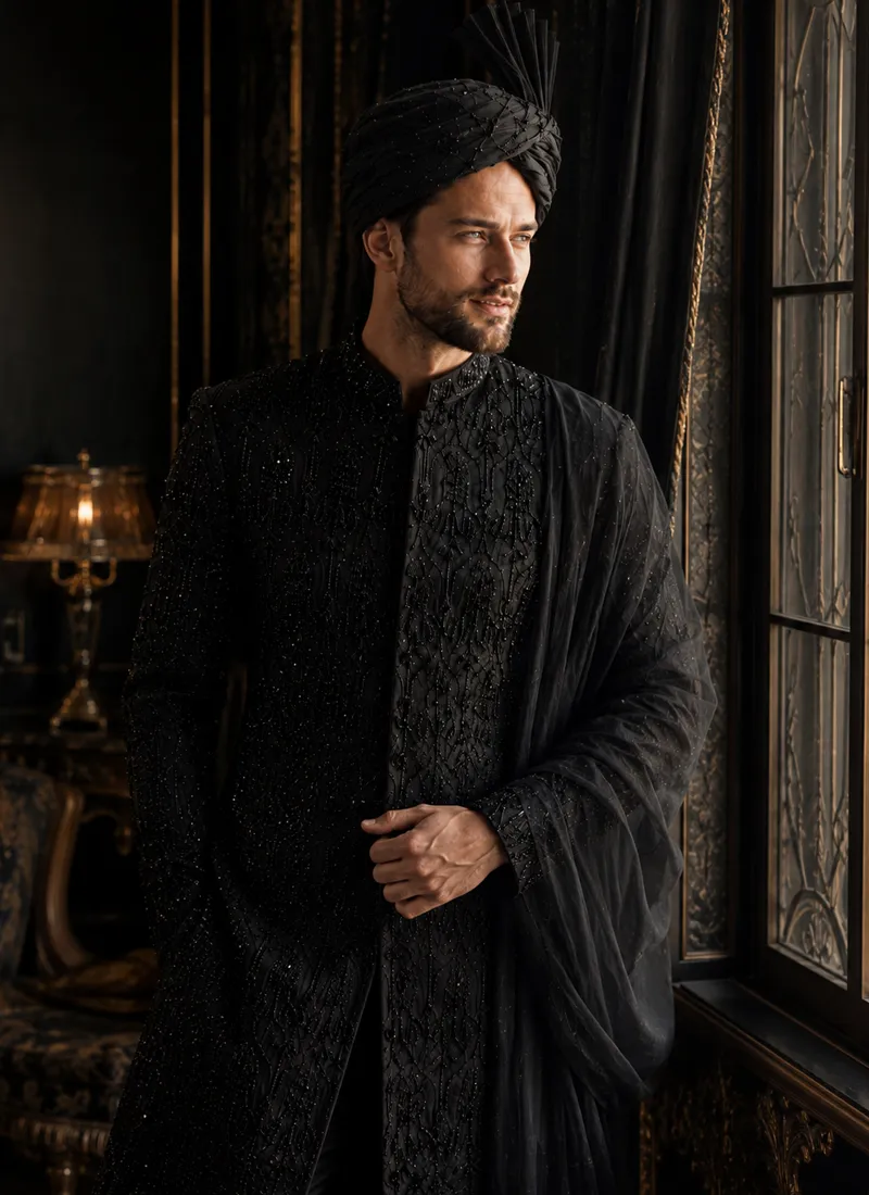 black-sherwani-with-black-shawl-turban-groom-look.webp Groom wearing a black sherwani with a matching turban and shawl