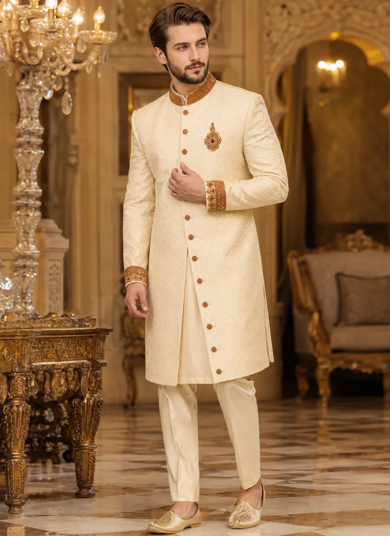 Cream sherwani for the groom, full-length front view with embellished buttons