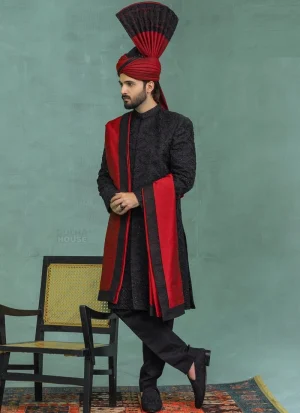 Black sherwani with red shawl and matching turban for groom wedding wear
