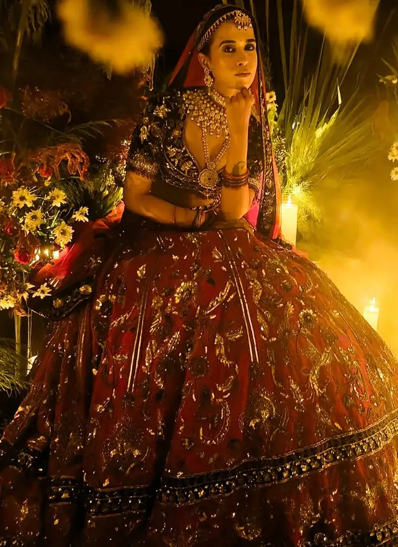 Crimson red velvet Indian bridal lehenga choli with black velvet blouse and antique zardozi work