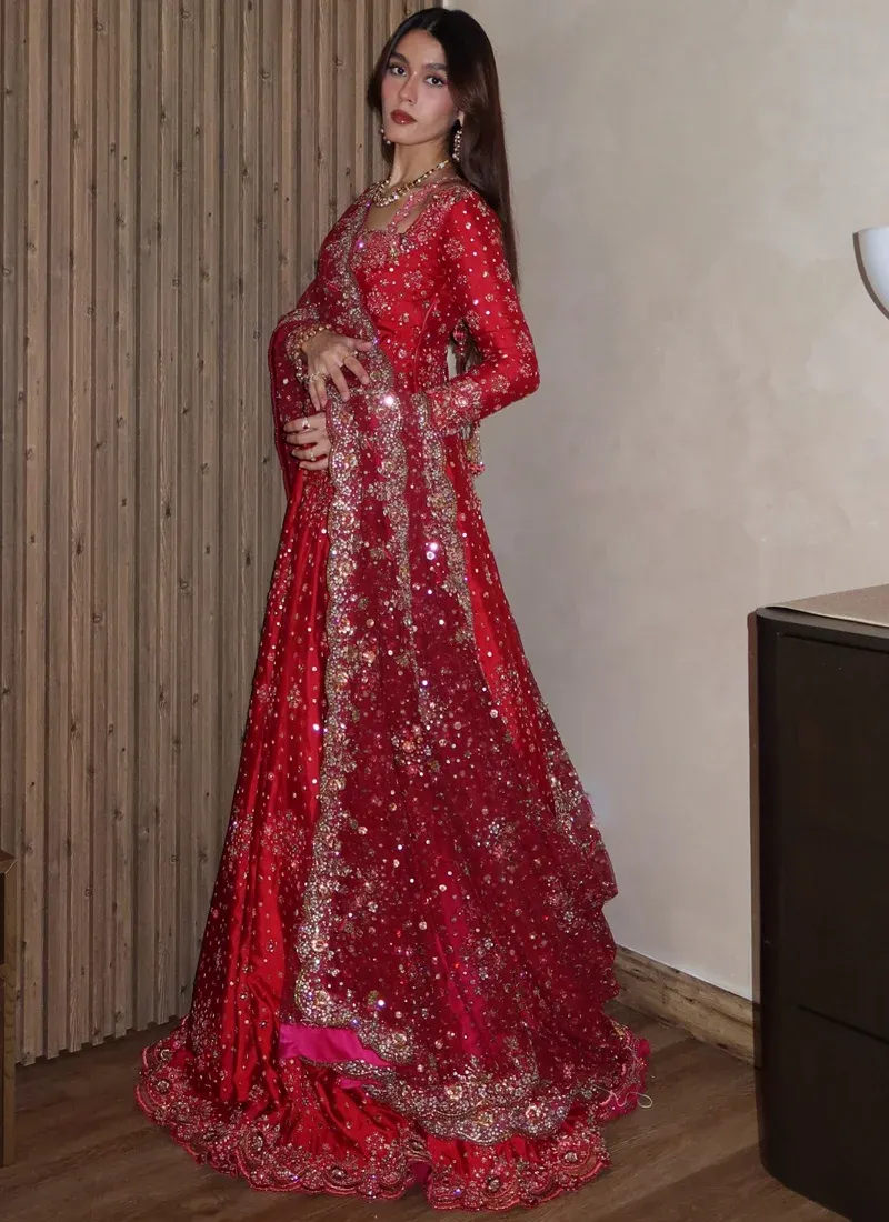 Crimson red wedding Pishwas for bride with intricate floral embroidery and traditional styling