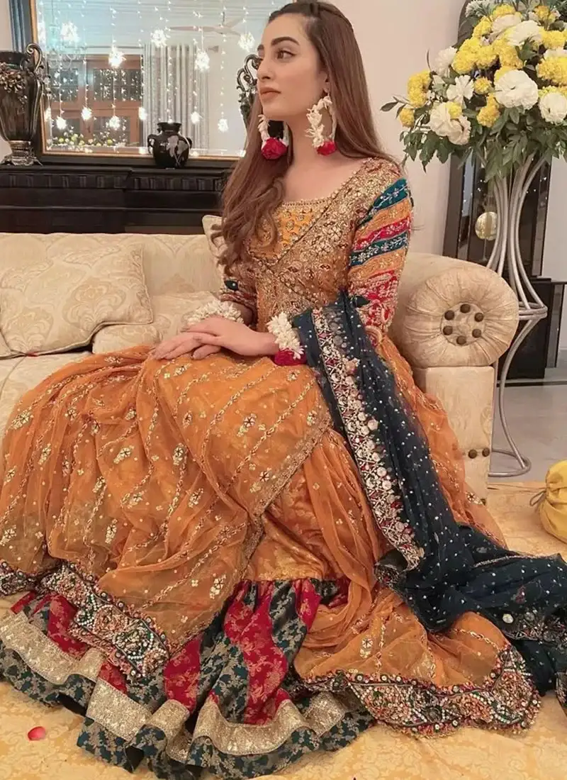 Multicolour embroidered Pakistani bridal Angrakha in mustard orange paired with a plum dupatta
