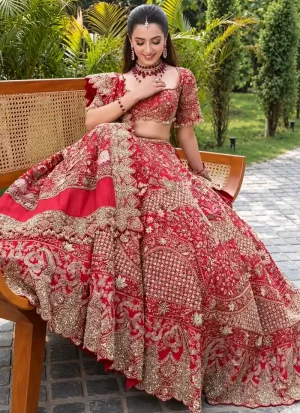 Rani pink bridal lehenga choli with gold-toned floral arch embroidery and banded scalloped hem