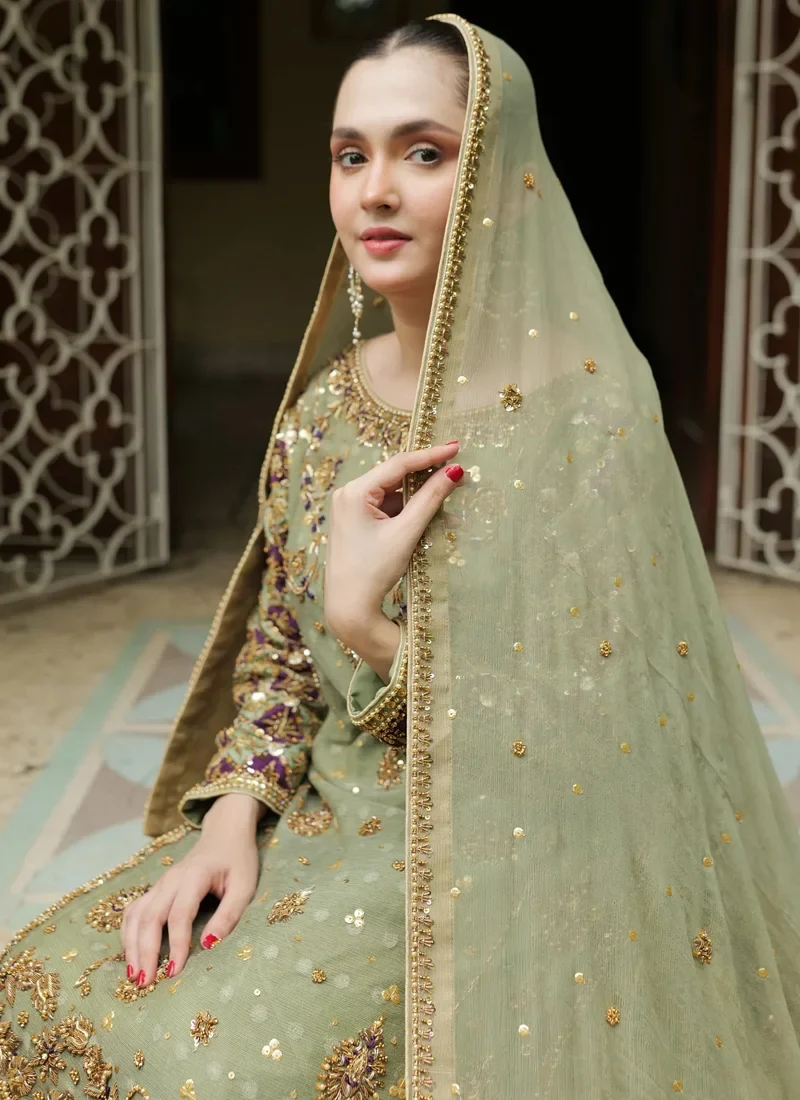 Sage green Pakistani bridal Farshi lehenga with purple border and intricate zardozi embroidery