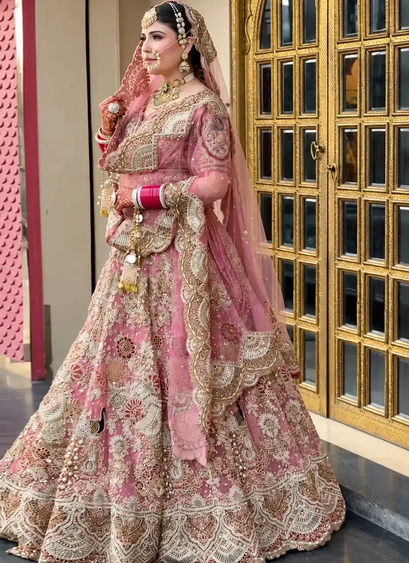 Traditional baby pink bridal lehenga choli with multicolour crystal dabka and graceful wedding styling