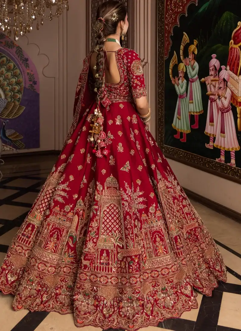 Traditional candy red bridal lehenga dress with floral resham embroidery and graceful wedding styling