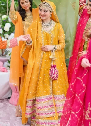 Yellow bridal Angrakha for Mehndi ceremony with intricate embroidery and elegant festive detailing