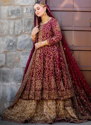 Burgundy bridal gown side view with gold floral vines and a bronze-gold flared lehenga