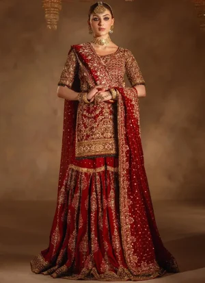 Deep red bridal gharara upper-front view showing gold lattice embroidery and green bead sleeve trim.