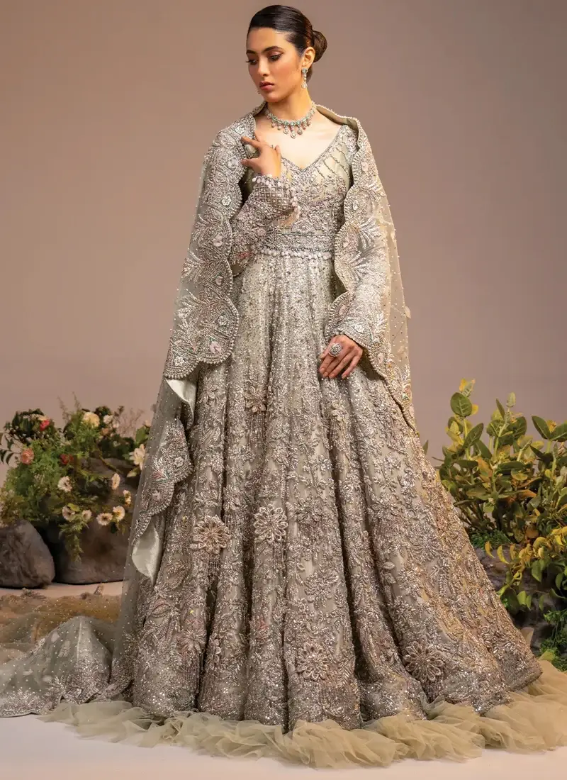 Ivory bridal gown back view with a flowing sheer dupatta and scalloped cutwork floral border.
