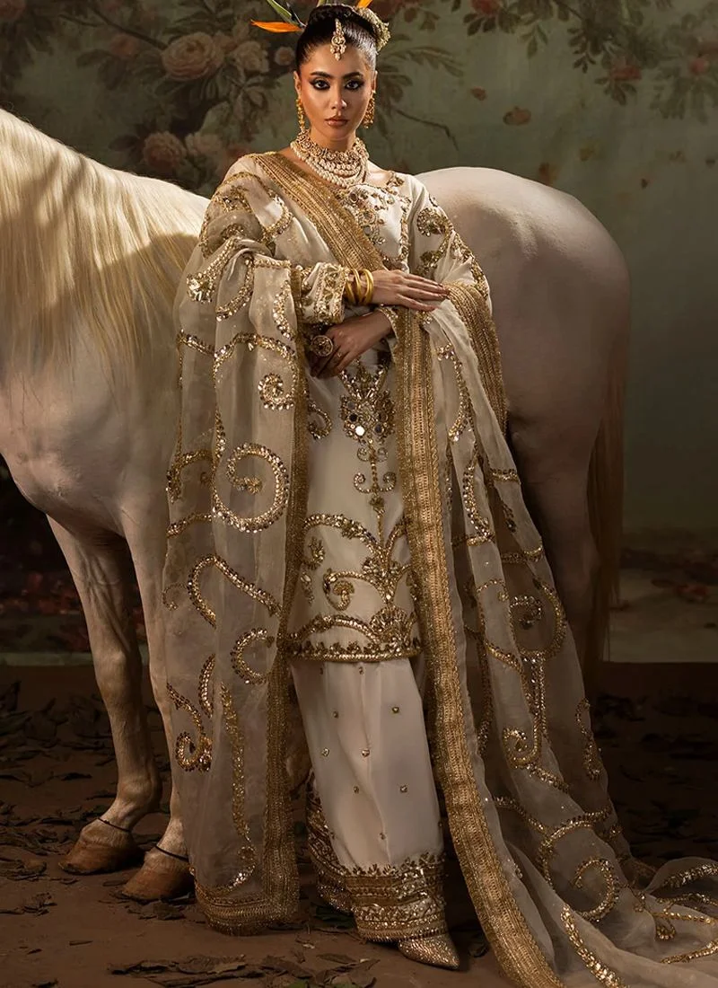 Ivory Wedding Guest Long Shirt Trousers Suit with Gota Scrollwork Dupatta Ivory kurti close-up with round neckline, gold mirror embellishments and organza dupatta with ornate gota motifs