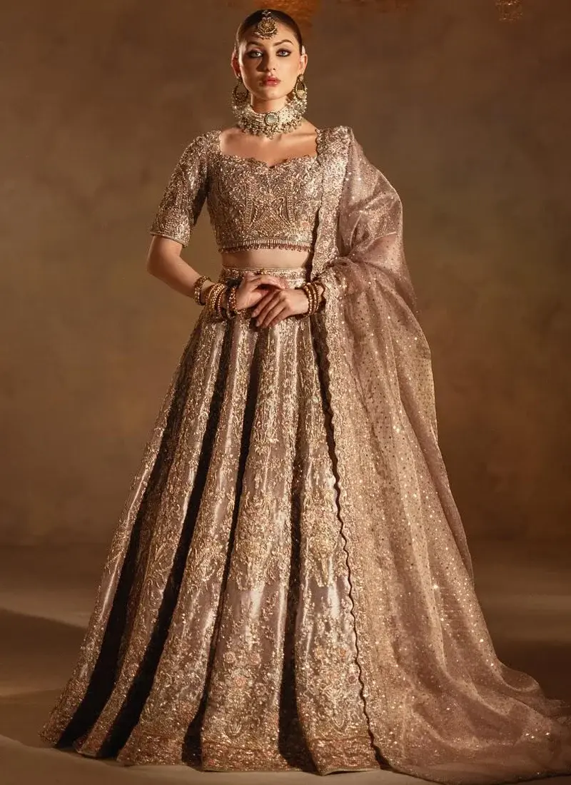 Lilac Reception Lehenga Choli with Crystal Tassel Fringe Smoky lilac bridal lehenga choli back view with gold embroidered flared skirt and trailing sheer dupatta