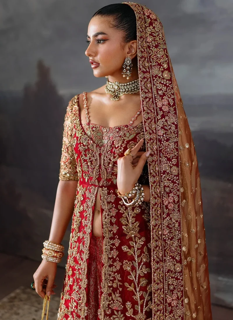 Red bridal gown neckline close-up with multicolour floral embroidery and chatta patti half sleeves