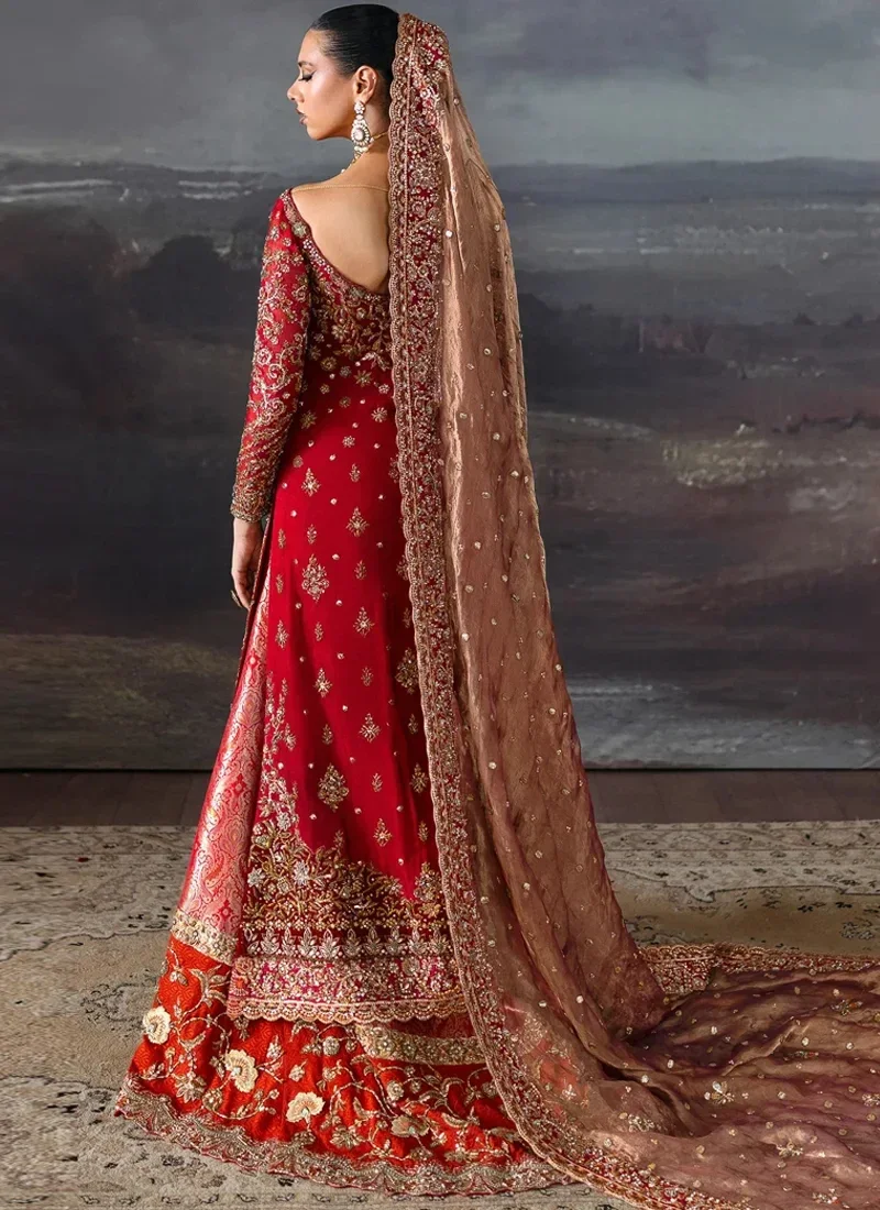 Red bridal long shirt and lehenga, rear full-length view with scalloped rose-gold dupatta border.
