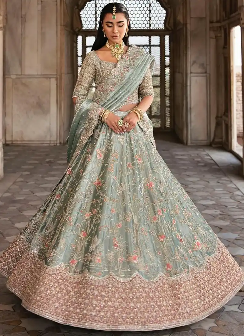 Sage Green Walima Lehenga Choli with Scalloped Floral Dupatta Border Sage green walima lehenga choli, full front view with pink floral vines and a wide rose-gold embroidered hem.