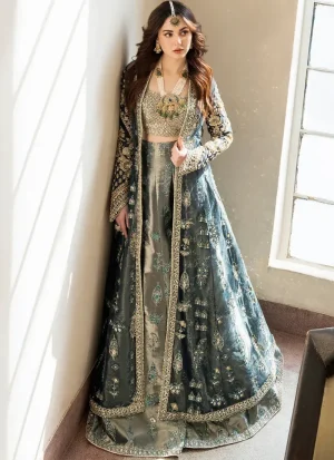Teal lehenga choli front close-up showing a gold crystal-studded bustier and richly embroidered jacket