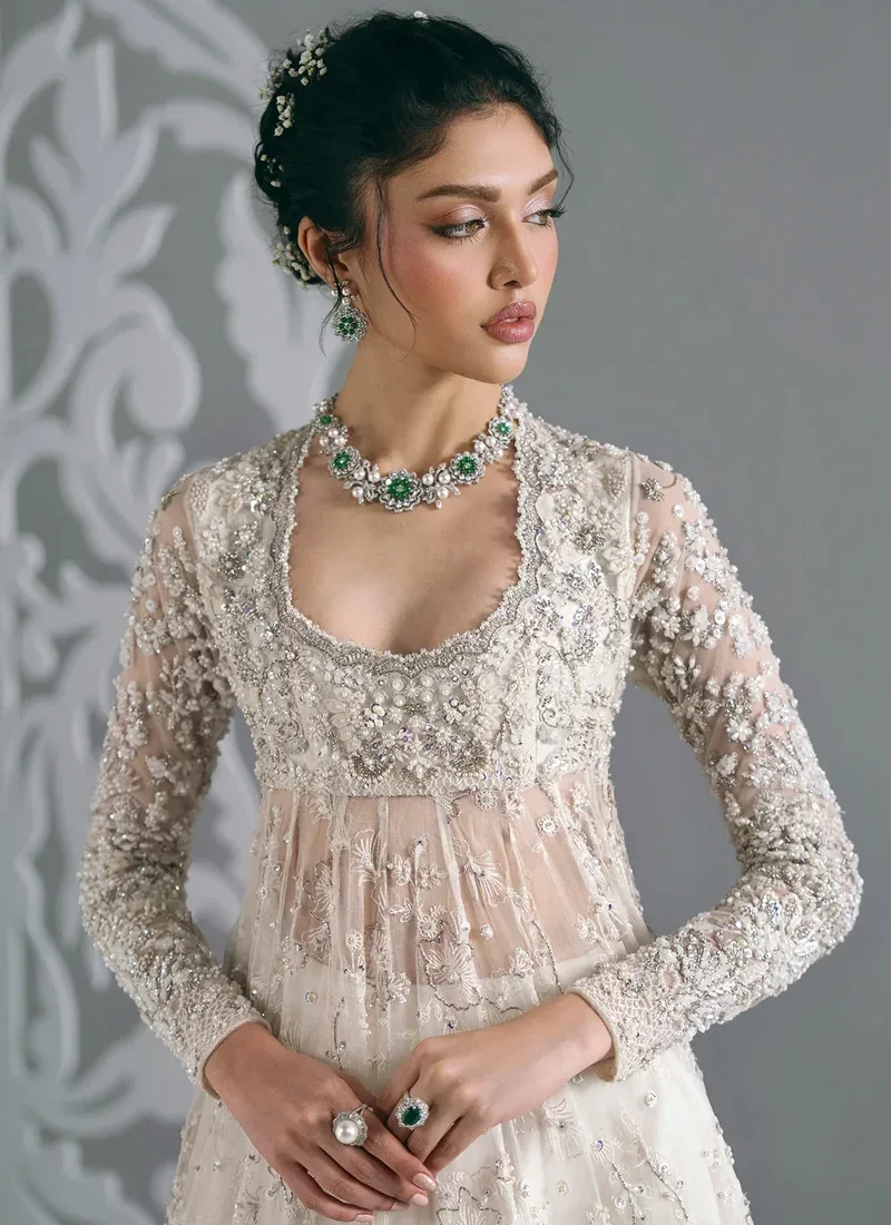 White Nikkah frock with lehenga, back view showing deep V tie-back and wide embroidered flare
